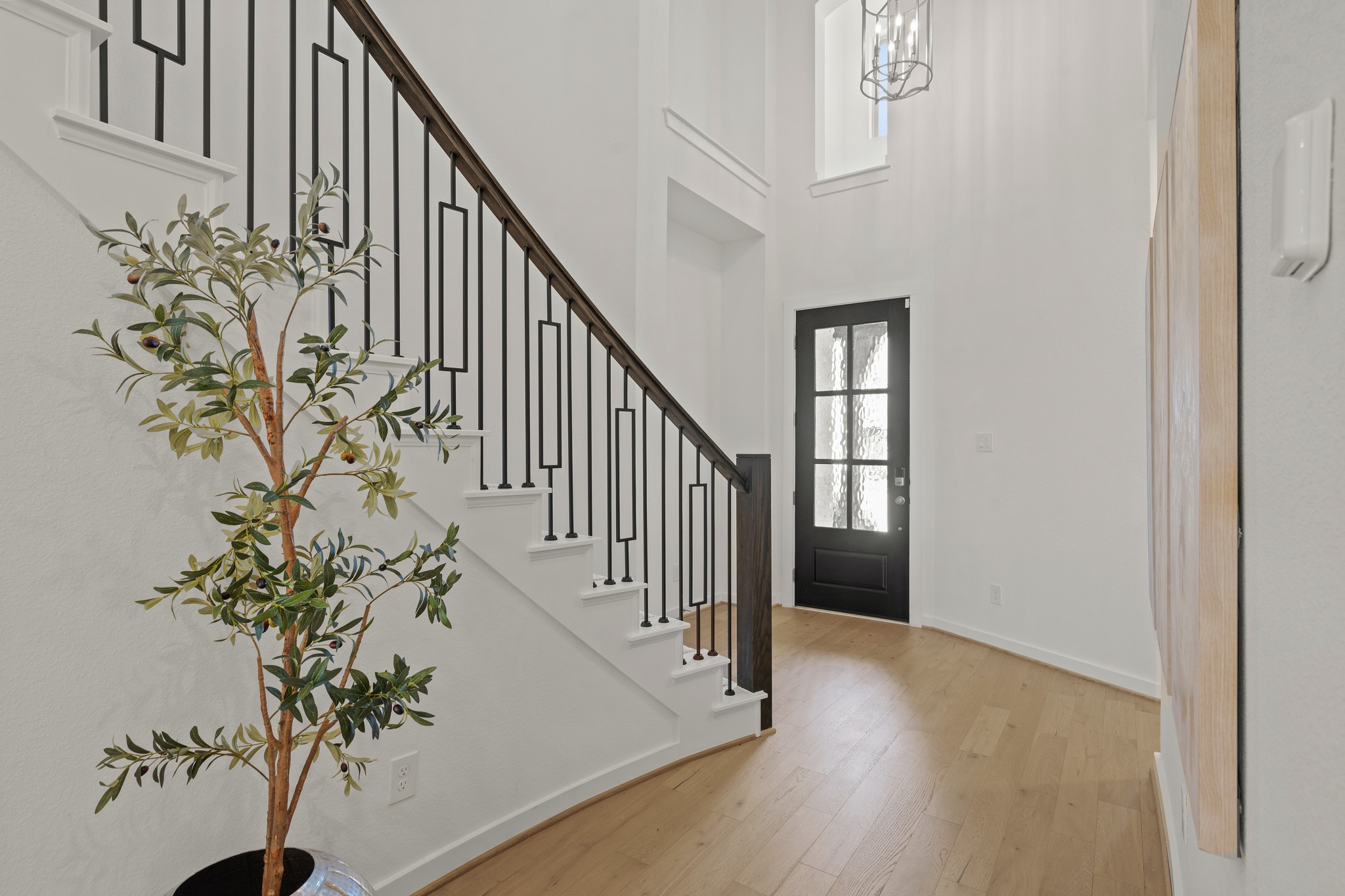 7303 Compass Drive Katy, TX 77493 - Photo 4 of 31 a view of an entryway with wooden floor