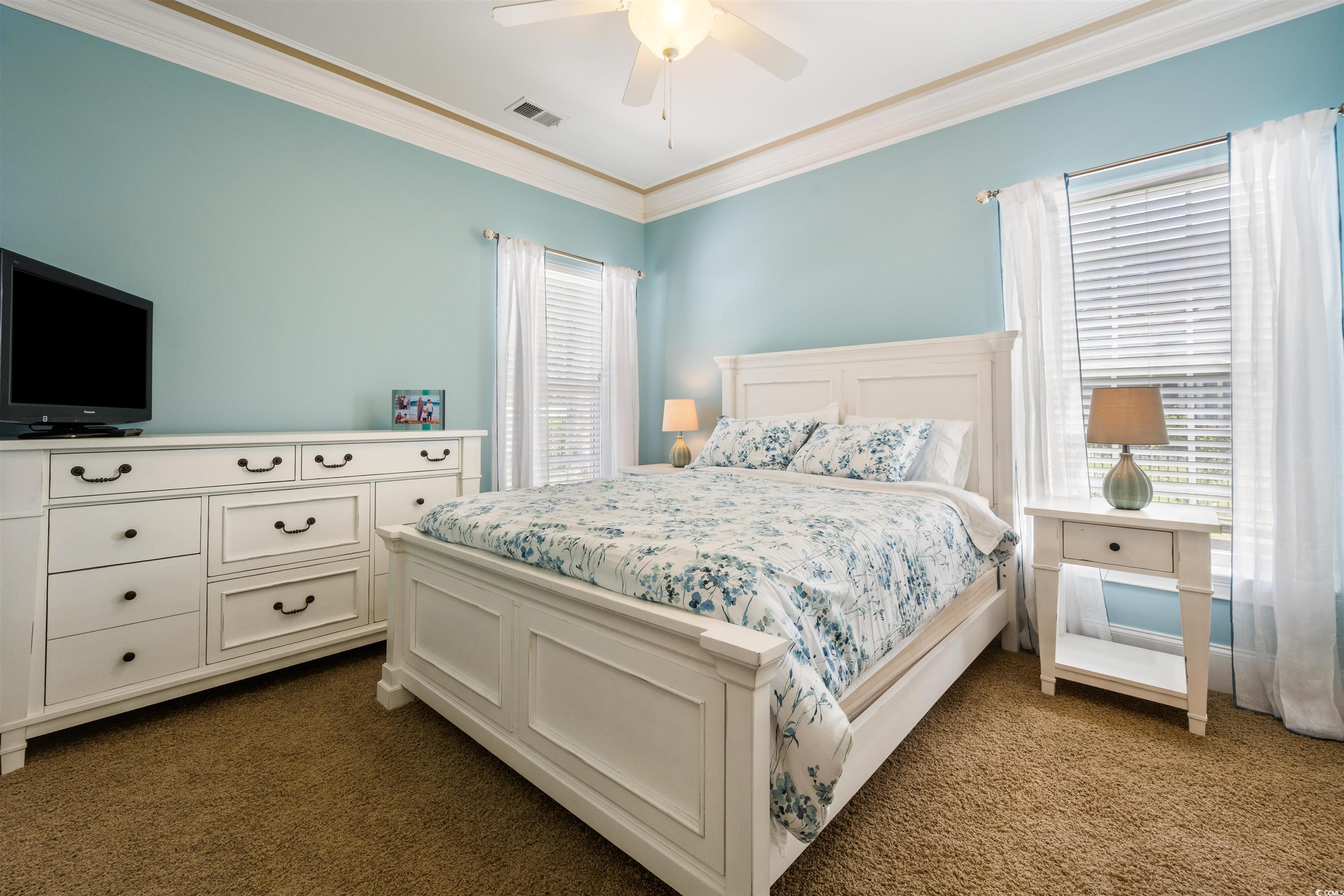 2073 Timmerman Road Myrtle Beach, SC 29588 - Photo 15 of 34 Bedroom with ornamental molding, dark carpet, and ceiling fan