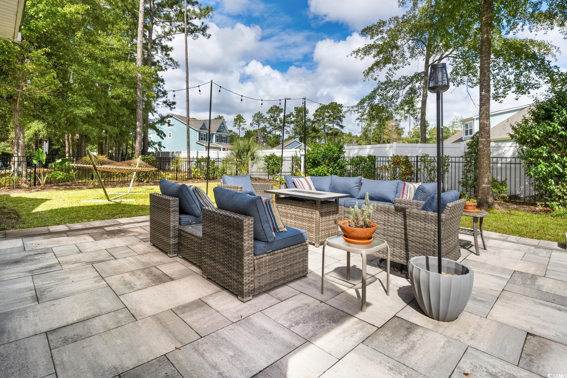 2073 Timmerman Road Myrtle Beach, SC 29588 - Photo 24 of 34 Fenced backyard with an outdoor living space and a patio