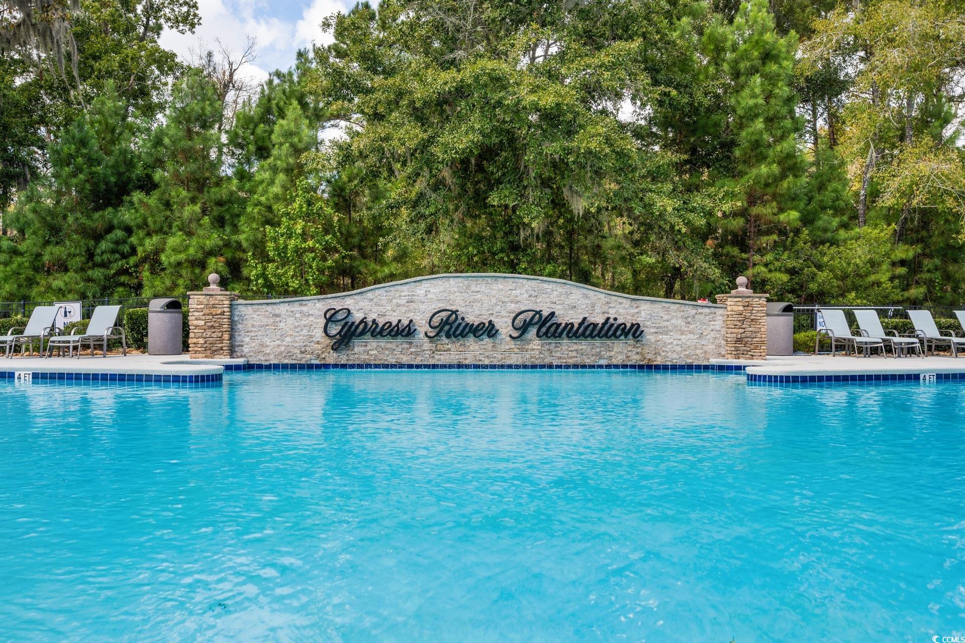 2073 Timmerman Road Myrtle Beach, SC 29588 - Photo 27 of 34 Community pool featuring a patio