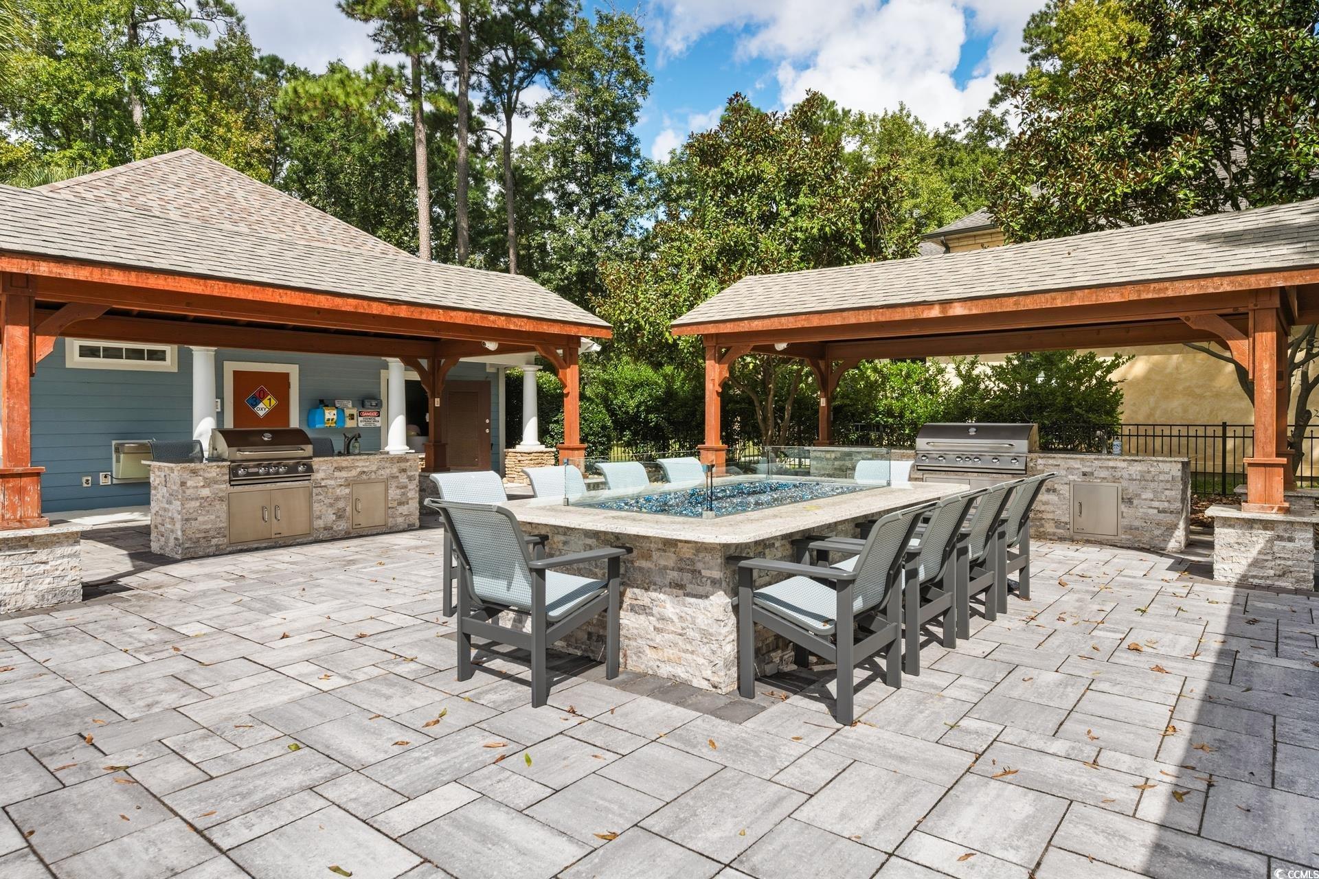 2073 Timmerman Road Myrtle Beach, SC 29588 - Photo 28 of 34 View of patio / terrace featuring an outdoor kitchen and view of wooded area