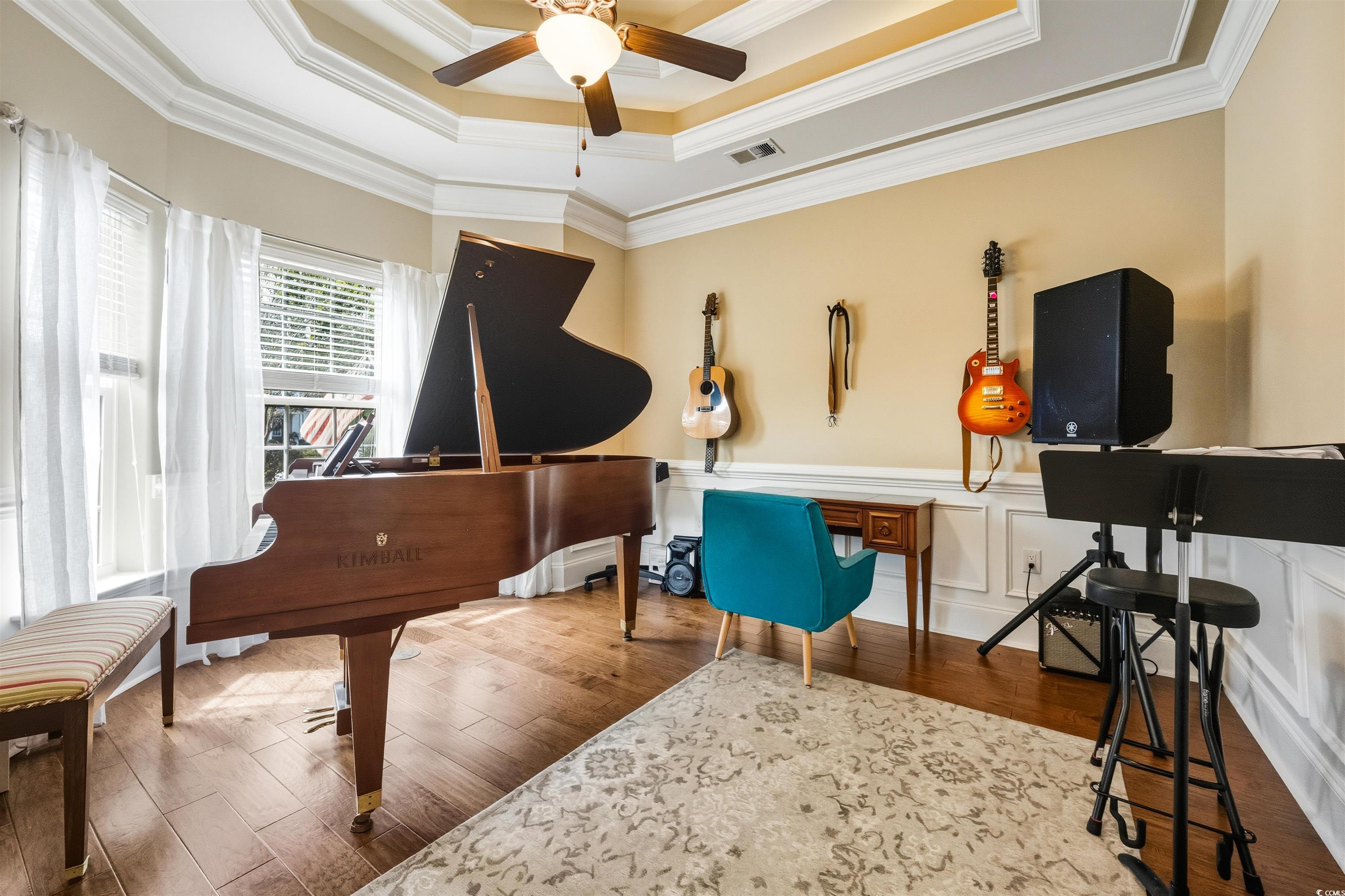 2073 Timmerman Road Myrtle Beach, SC 29588 - Photo 5 of 34 Flex room with a raised ceiling, ornamental molding, a wainscoted wall, dark wood-style flooring, and a ceiling fan