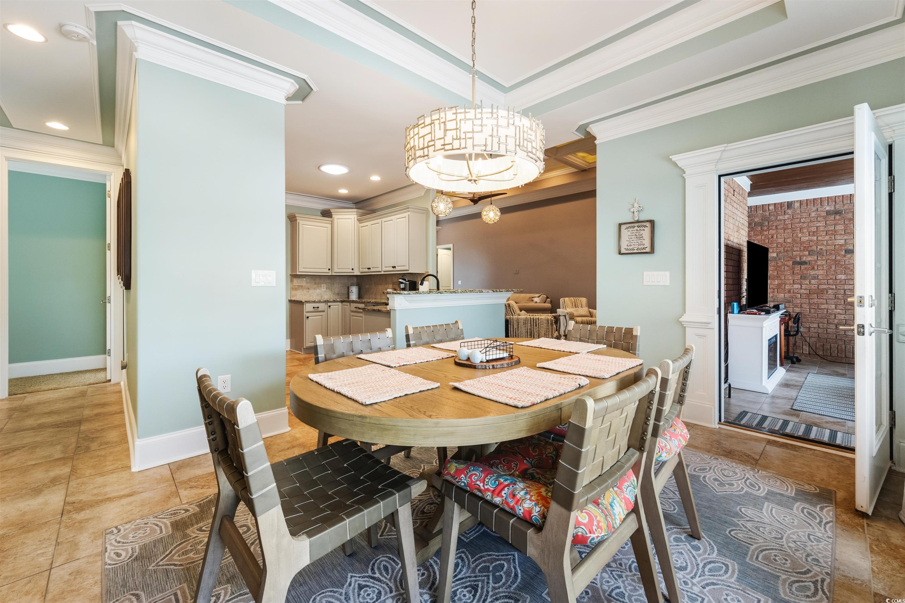 2073 Timmerman Road Myrtle Beach, SC 29588 - Photo 10 of 34 Breakfast Nook featuring light tile patterned floors, ornamental molding, and recessed lighting