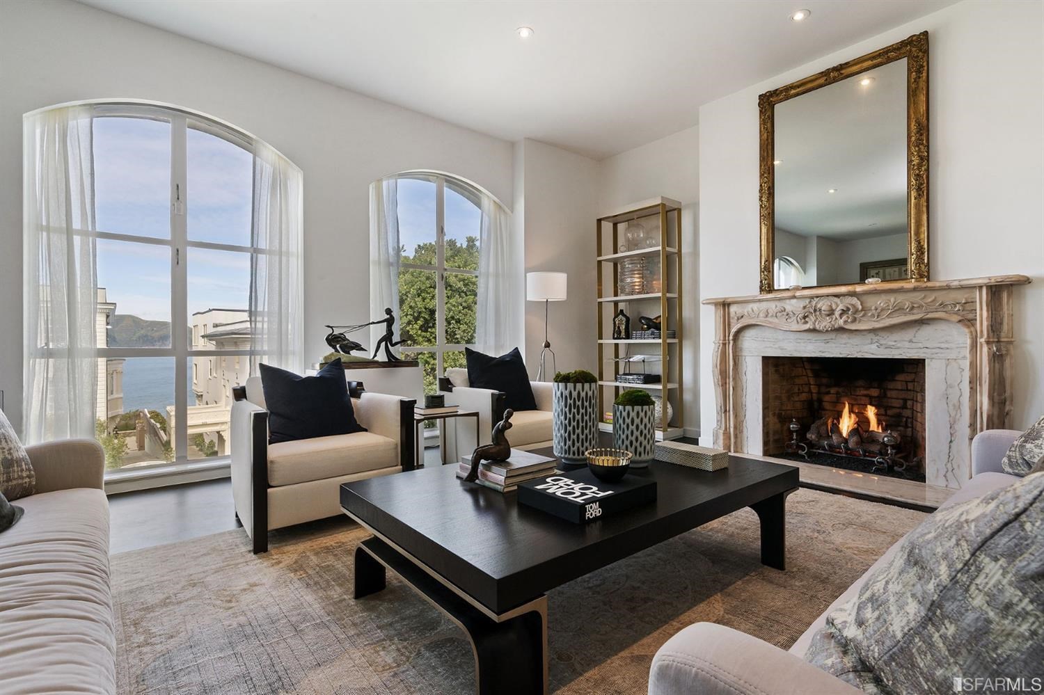 135 Sea Cliff Avenue San Francisco, CA 94121 - Photo 12 of 69 a living room with furniture and a fireplace