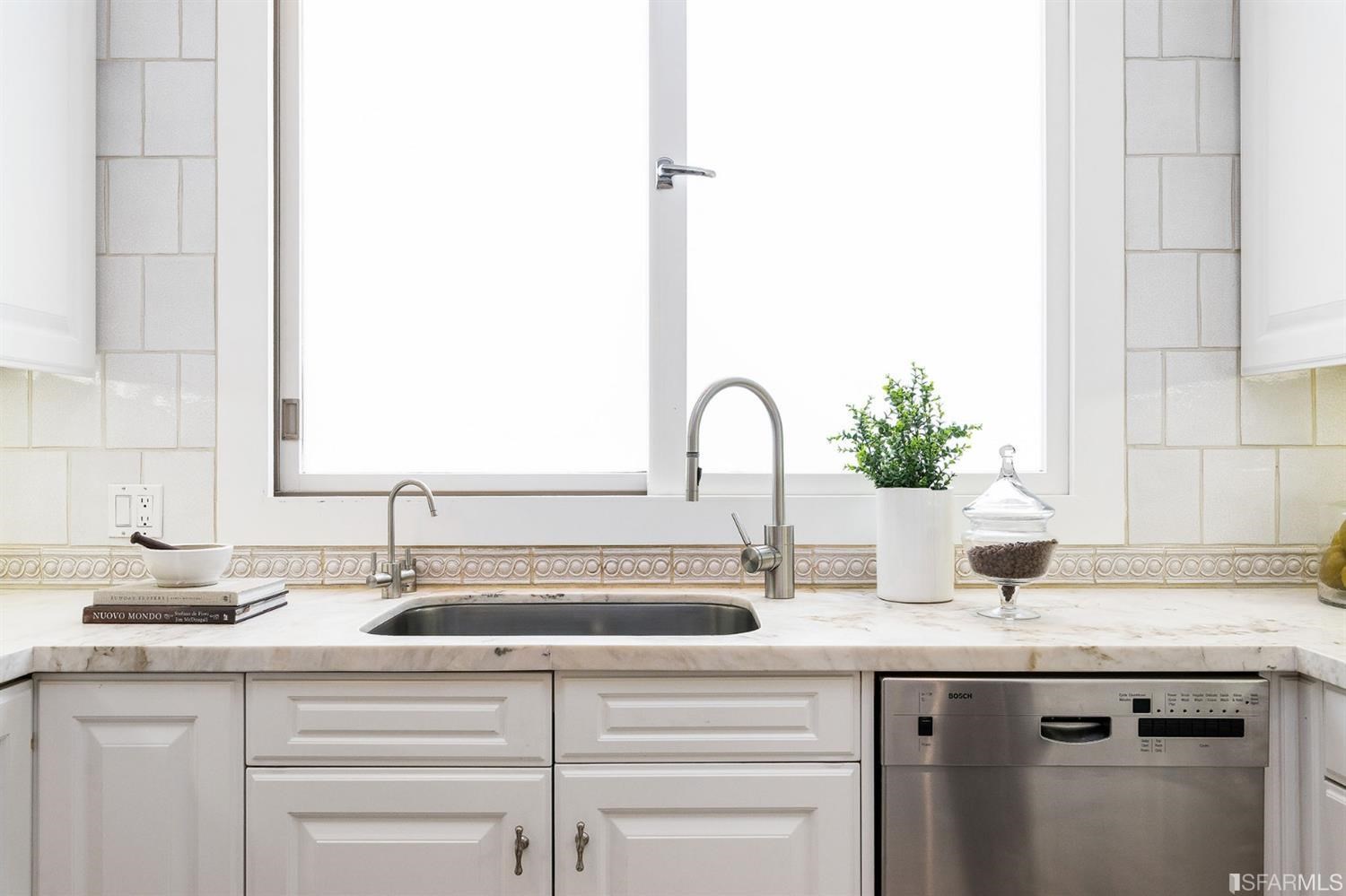 135 Sea Cliff Avenue San Francisco, CA 94121 - Photo 21 of 69 a kitchen with a sink and a potted plant