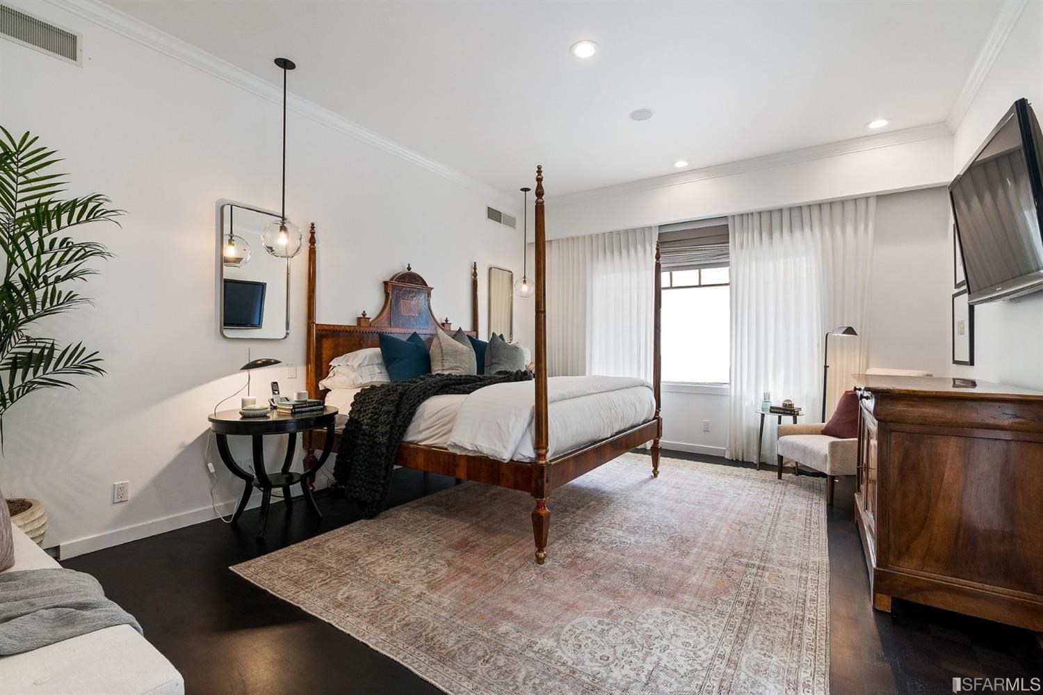 135 Sea Cliff Avenue San Francisco, CA 94121 - Photo 29 of 69 a living room with furniture a dining table and a fireplace