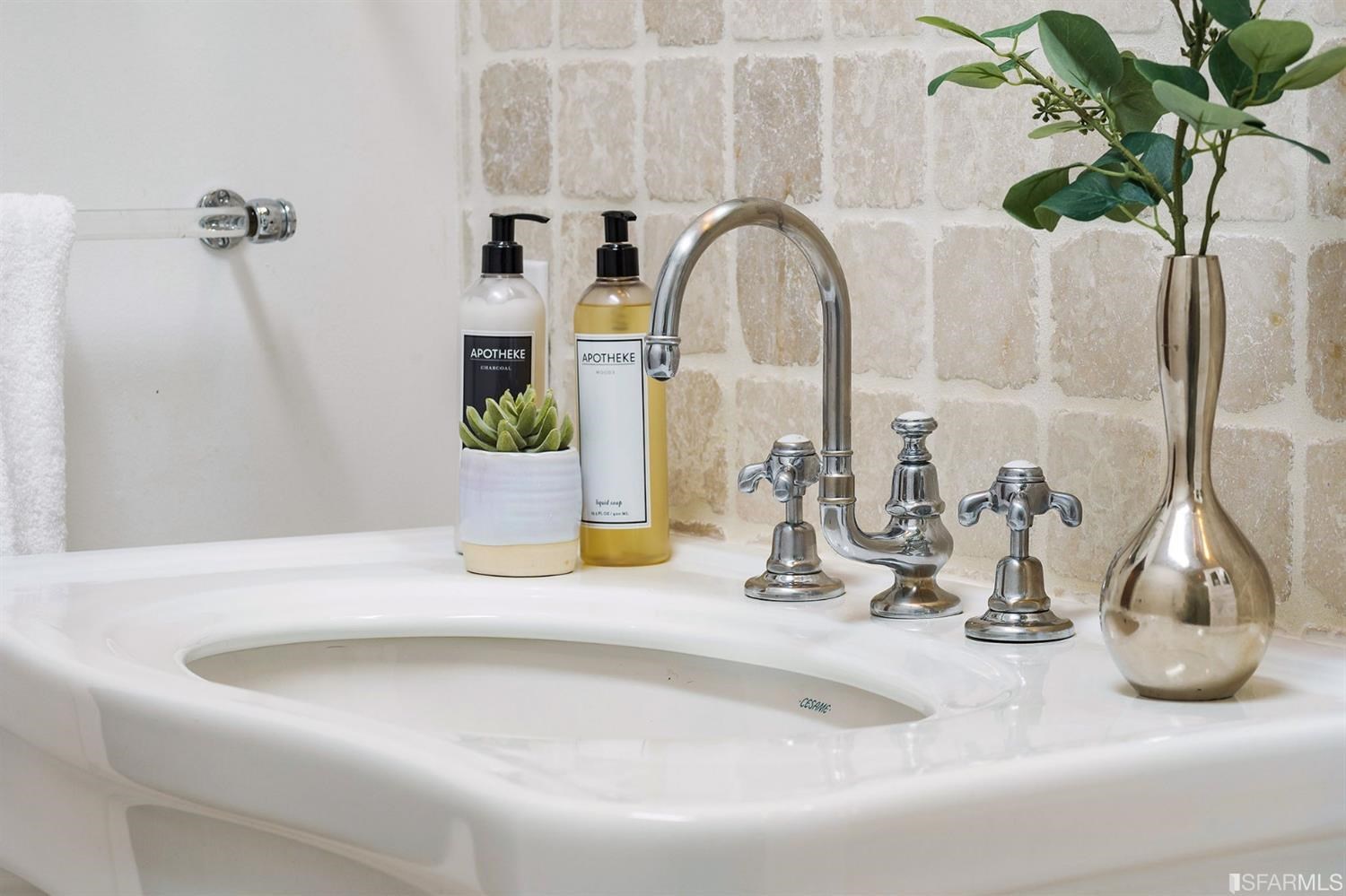 135 Sea Cliff Avenue San Francisco, CA 94121 - Photo 34 of 69 a bathroom with a sink a mirror and a potted plant