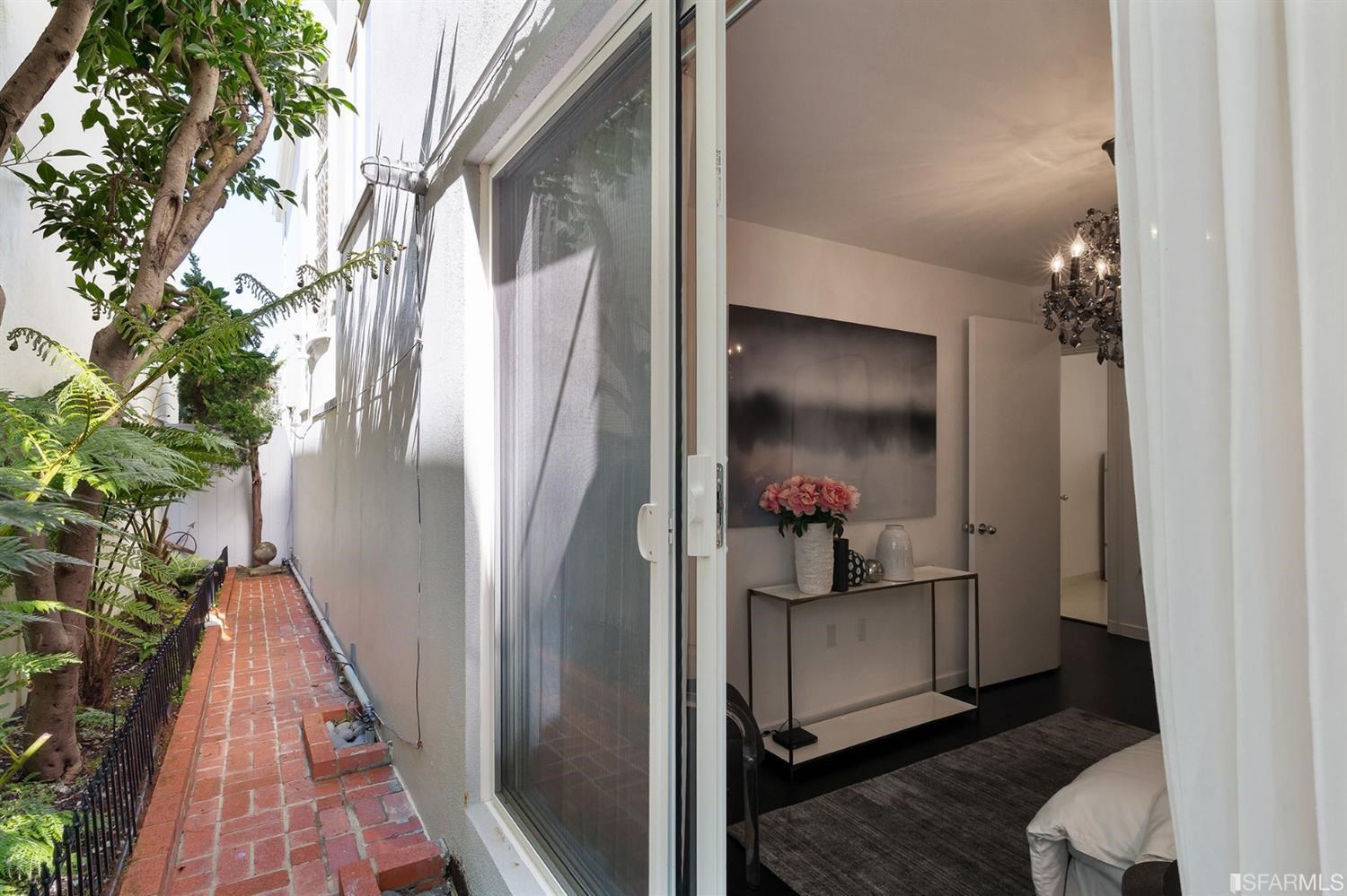 135 Sea Cliff Avenue San Francisco, CA 94121 - Photo 54 of 69 a view of a hallway with wooden floor and stairs