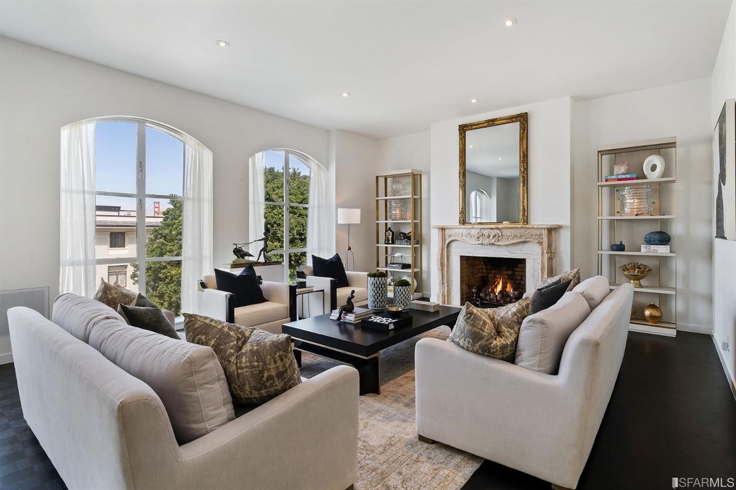 135 Sea Cliff Avenue San Francisco, CA 94121 - Photo 8 of 69 a living room with furniture and a fireplace