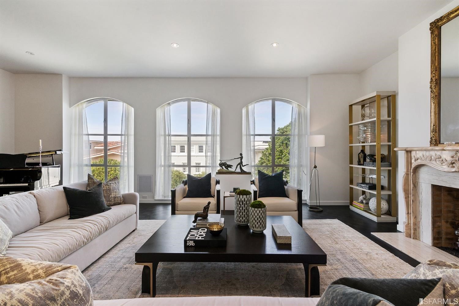 135 Sea Cliff Avenue San Francisco, CA 94121 - Photo 10 of 69 a living room with furniture large window and a fireplace