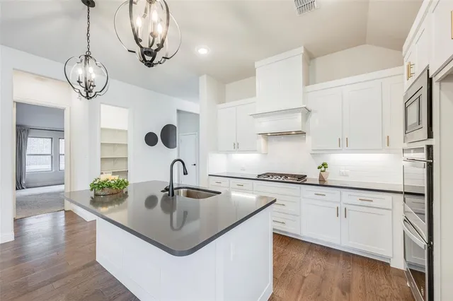 a living room with furniture fireplace and a potted plant