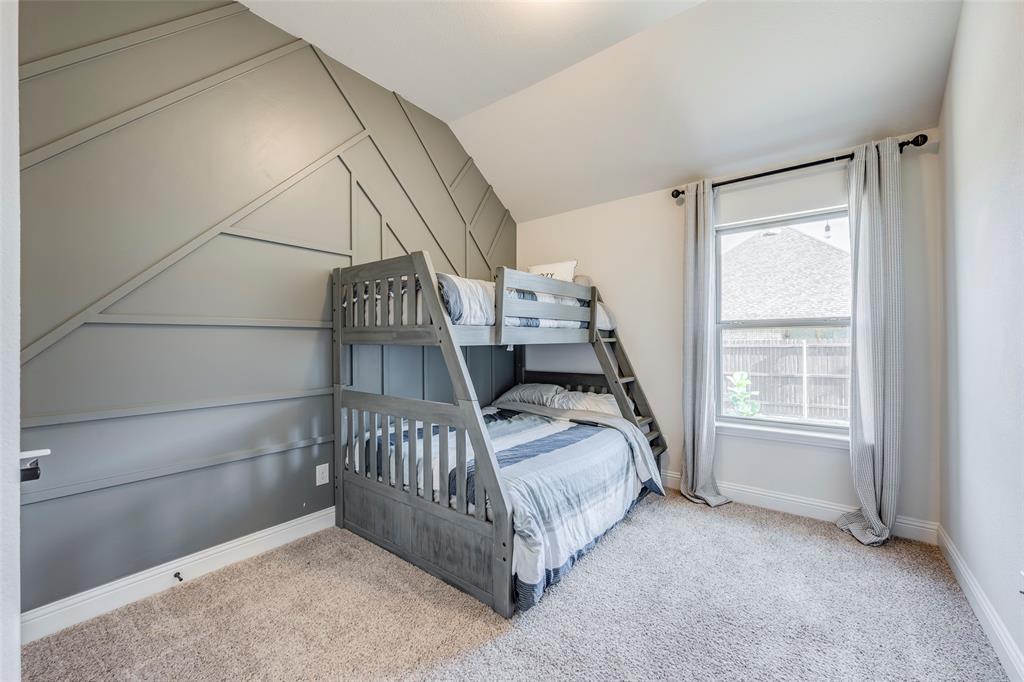 14304 Spitfire Trail Fort Worth, TX 76262 - Photo 18 of 31 a bed sitting in a room next to a window