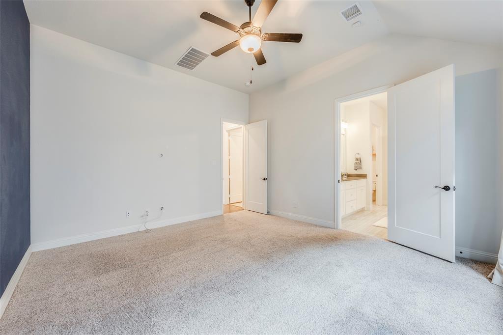 14304 Spitfire Trail Fort Worth, TX 76262 - Photo 23 of 31 an empty room with fan and a ceiling fan