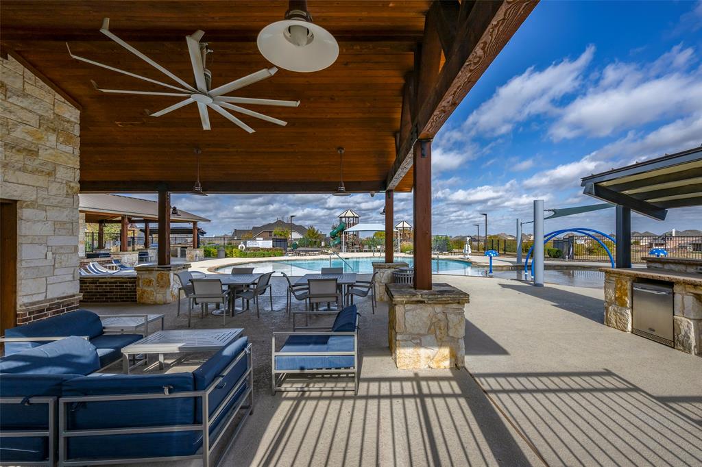 14304 Spitfire Trail Fort Worth, TX 76262 - Photo 30 of 31 View of patio / terrace with area for grilling, a ceiling fan, outdoor lounge area, and a community pool