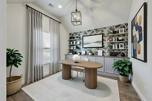 an empty room with a cabinet and mirrors