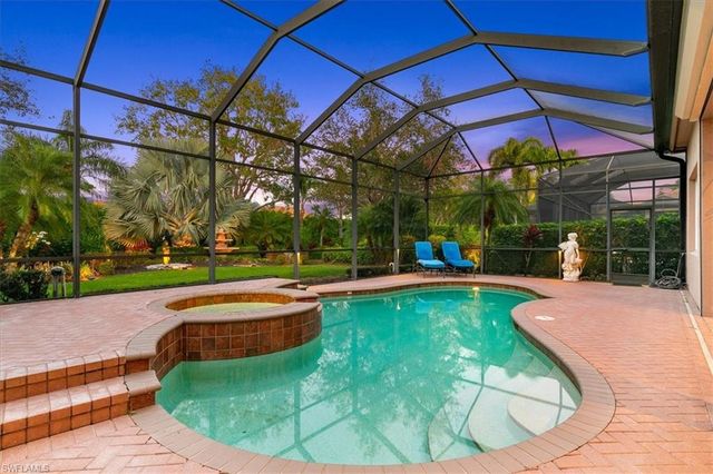 a view of a swimming pool with a patio