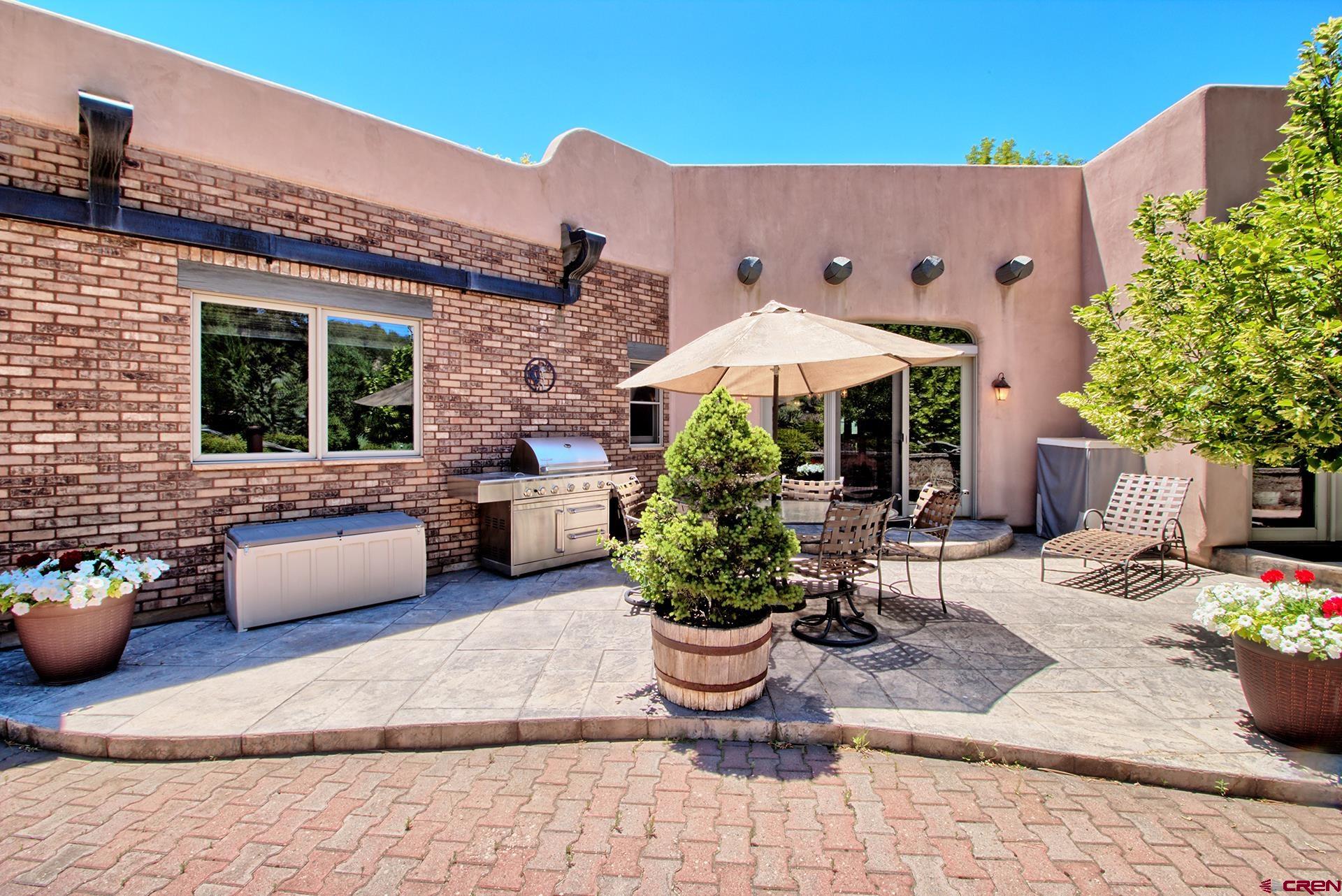 2000 Castle Peak Ranch Road Eagle, CO 81631 - Photo 15 of 35 a view of a patio with furniture and potted plants