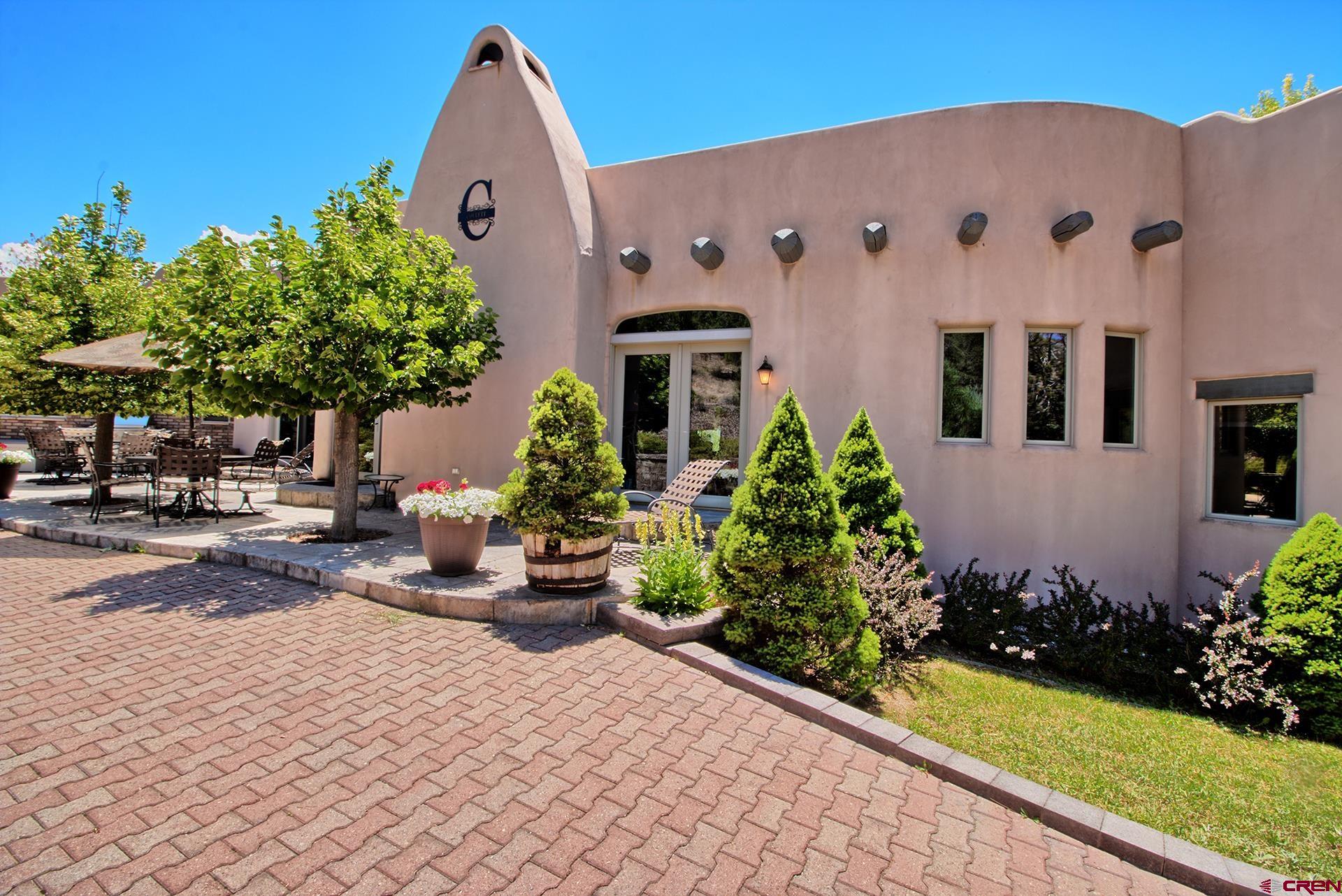 2000 Castle Peak Ranch Road Eagle, CO 81631 - Photo 16 of 35 a group of cars parked in front of a white house
