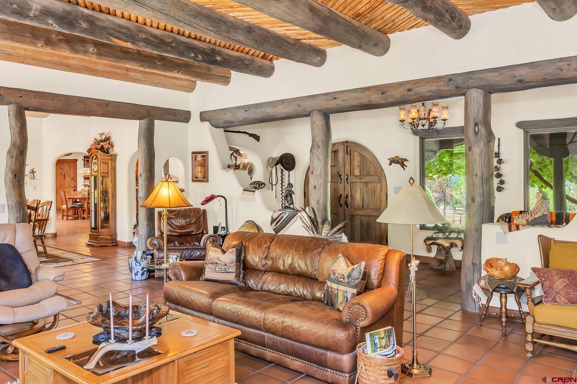 2000 Castle Peak Ranch Road Eagle, CO 81631 - Photo 24 of 35 a living room with furniture and a large window