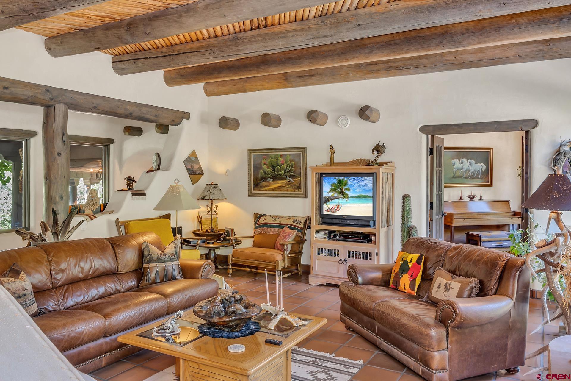 2000 Castle Peak Ranch Road Eagle, CO 81631 - Photo 25 of 35 a living room with furniture and a flat screen tv