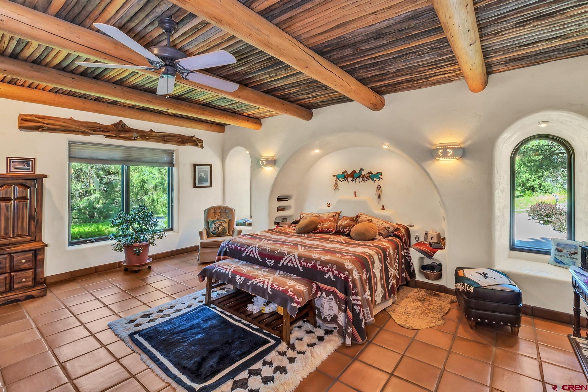 2000 Castle Peak Ranch Road Eagle, CO 81631 - Photo 34 of 35 a bed room with a bed furniture and a large window