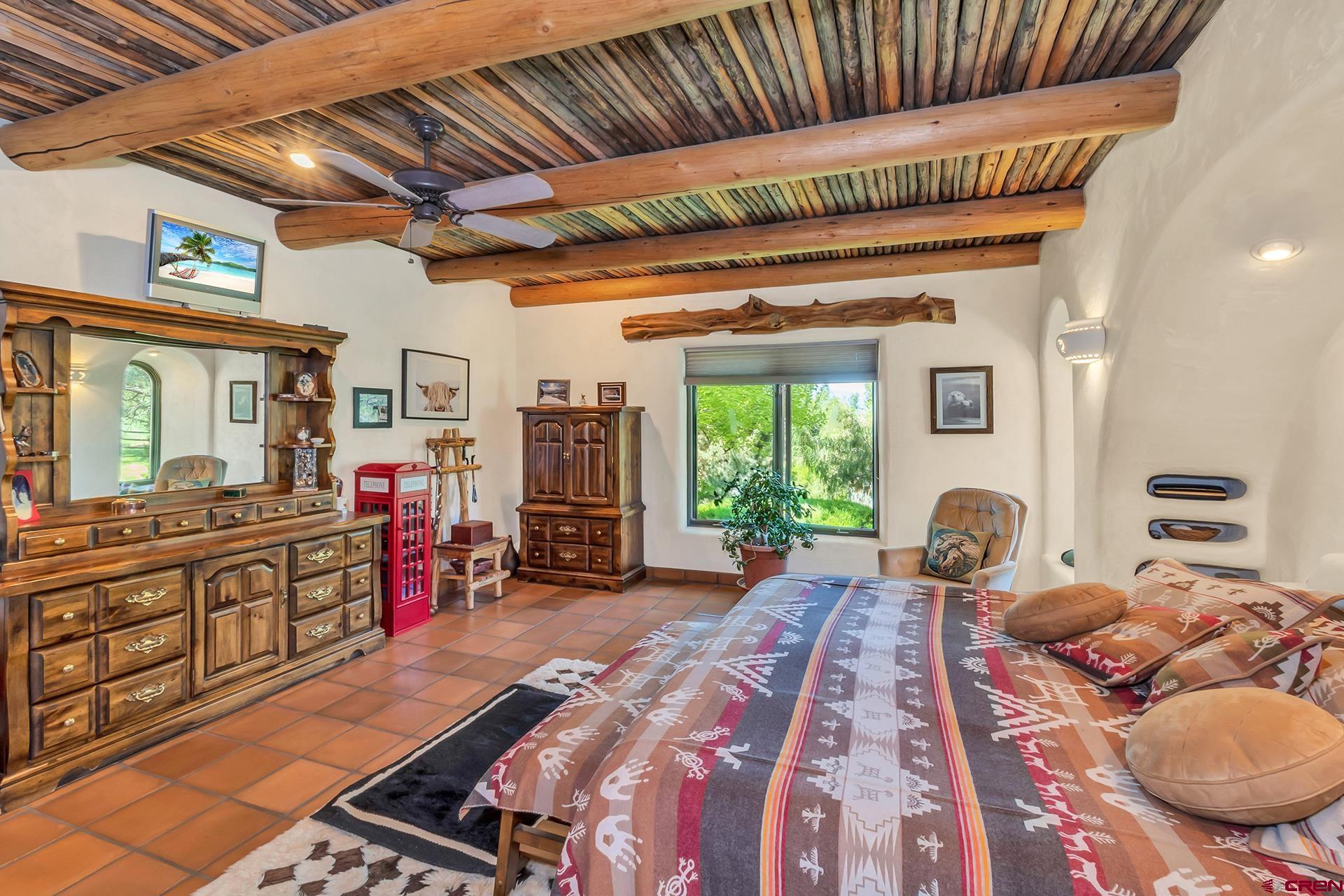 2000 Castle Peak Ranch Road Eagle, CO 81631 - Photo 35 of 35 a bed room with furniture and a wooden floor