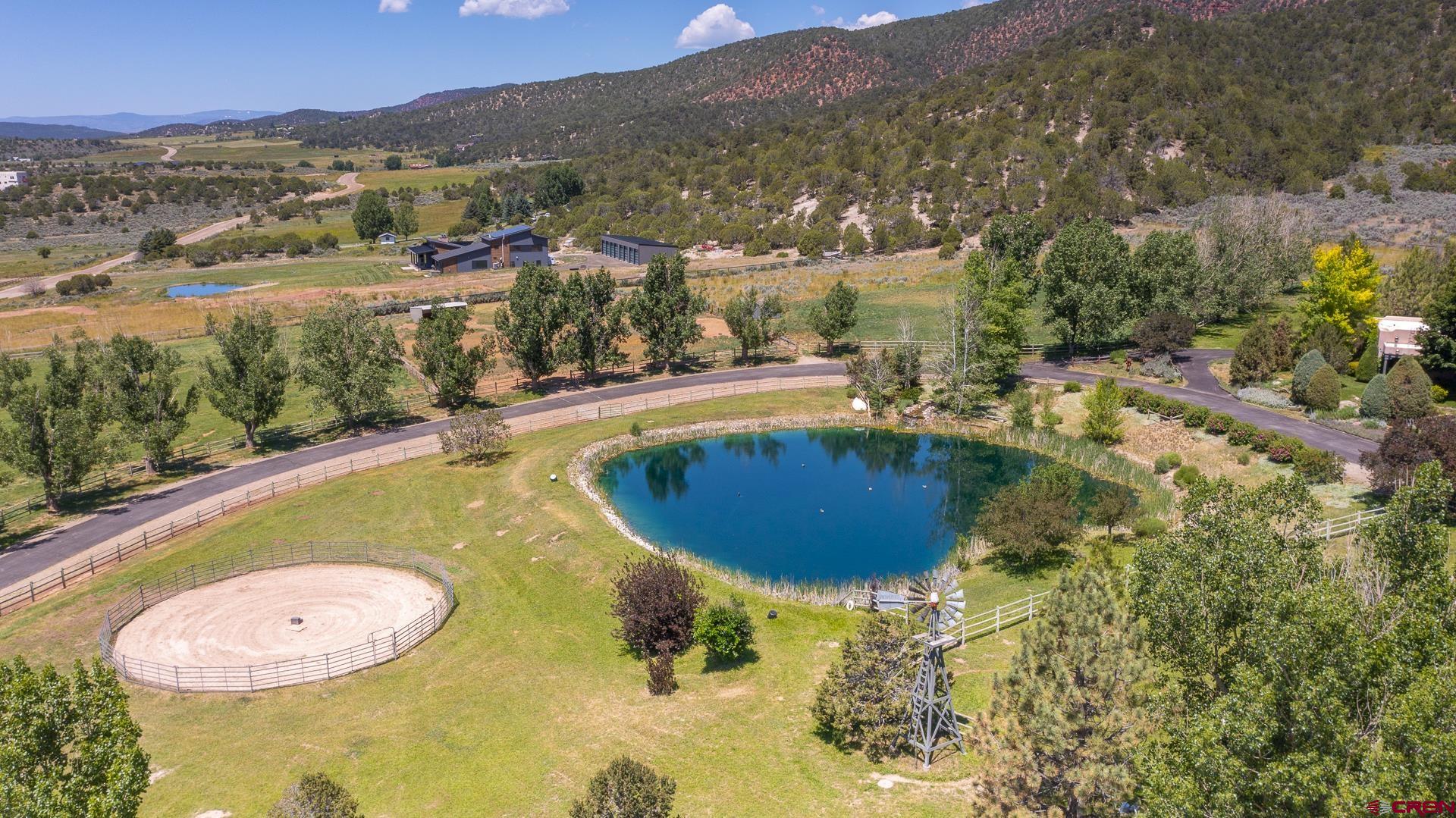 2000 Castle Peak Ranch Road Eagle, CO 81631 - Photo 4 of 35 a view of a swimming pool with a yard and mountain view