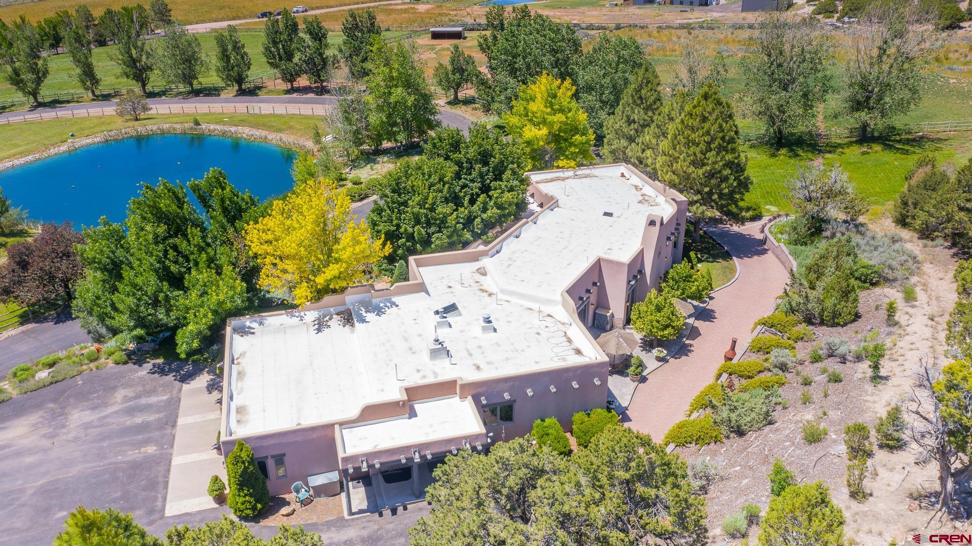 2000 Castle Peak Ranch Road Eagle, CO 81631 - Photo 8 of 35 an aerial view of a house with a swimming pool yard and outdoor seating