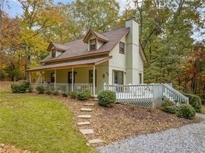 667 Running Deer Road Cleveland, GA 30528 - Photo 1 of 1 a front view of a house with garden