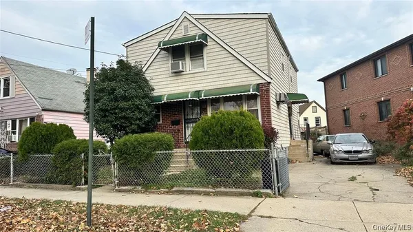 a front view of a house with parking