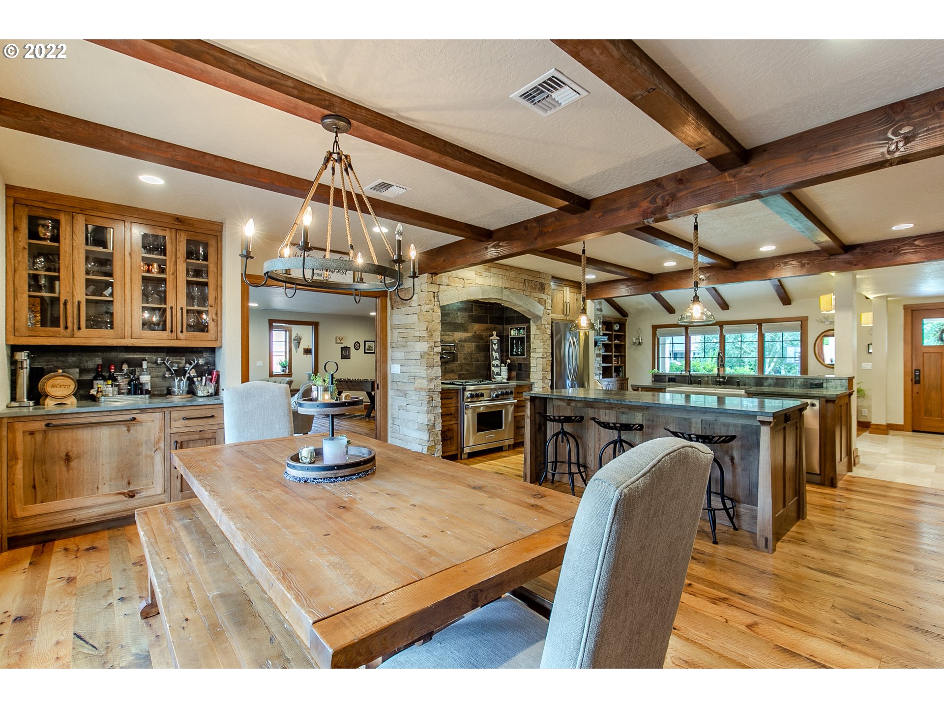 2115 Bedford Way Eugene, OR 97401 - Photo 11 of 32 a kitchen with stainless steel appliances granite countertop a stove a sink dishwasher and white cabinets with wooden floor