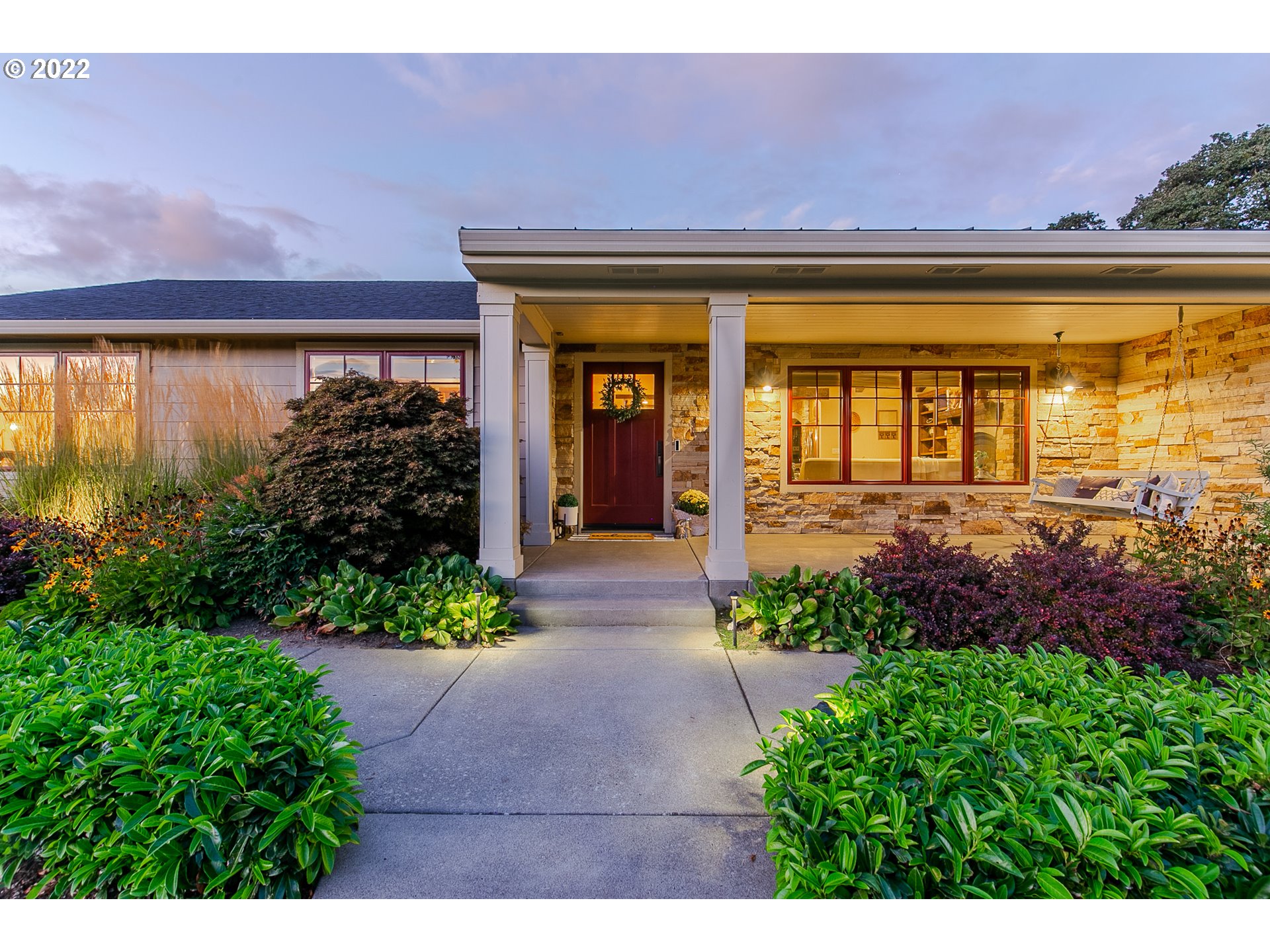 2115 Bedford Way Eugene, OR 97401 - Photo 2 of 32 a front view of a house with a yard and potted plants