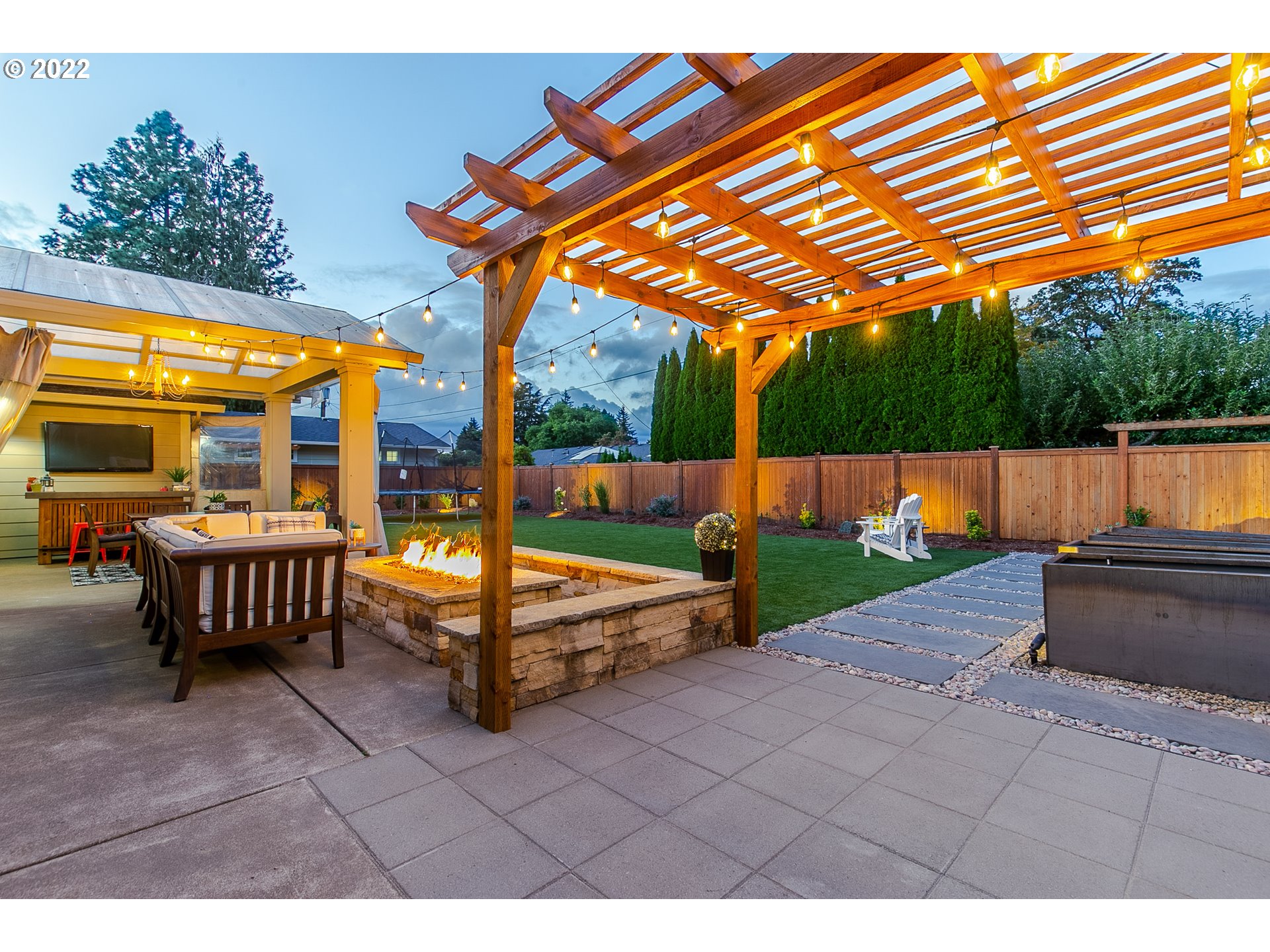 2115 Bedford Way Eugene, OR 97401 - Photo 31 of 32 a backyard of a house with barbeque oven table and chairs