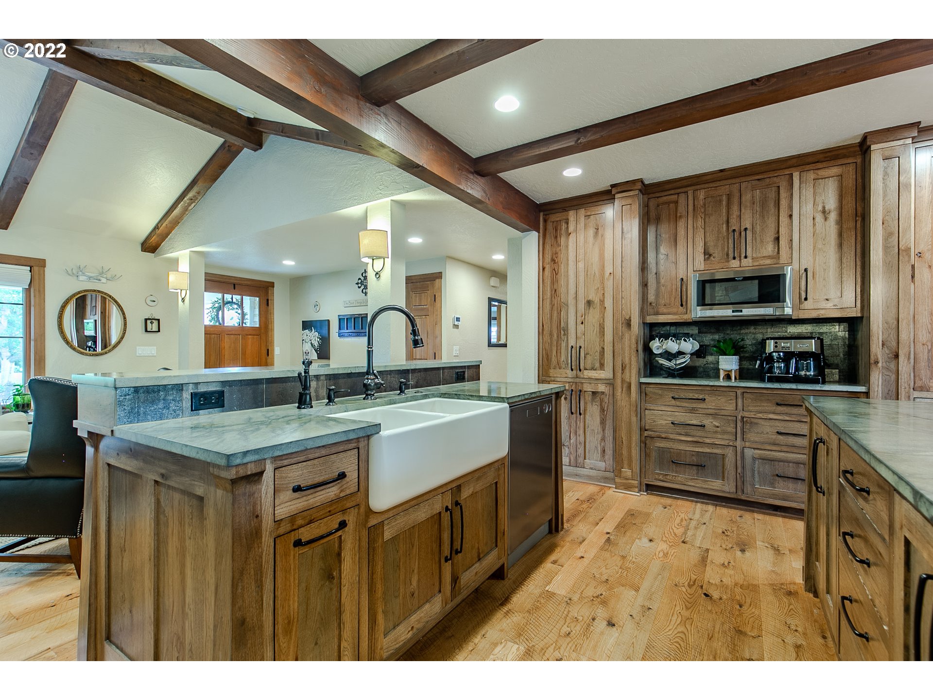 2115 Bedford Way Eugene, OR 97401 - Photo 6 of 32 a kitchen with stainless steel appliances granite countertop a stove a sink and a refrigerator