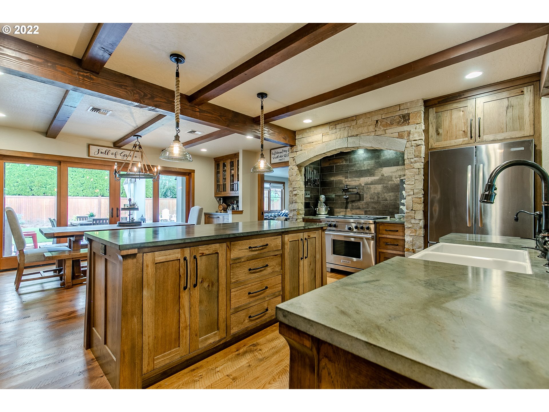 2115 Bedford Way Eugene, OR 97401 - Photo 8 of 32 a kitchen with stainless steel appliances granite countertop a sink a stove and refrigerator