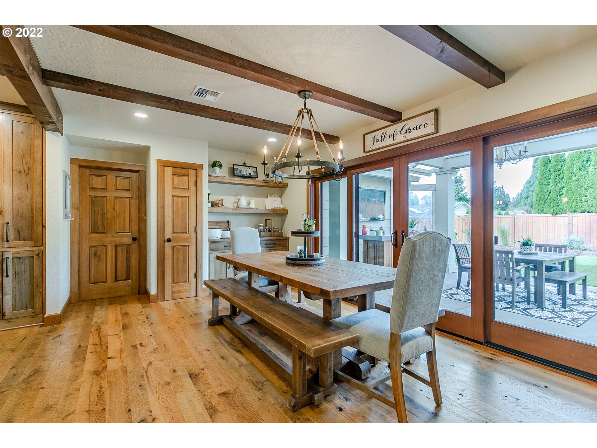 2115 Bedford Way Eugene, OR 97401 - Photo 9 of 32 a view of a dining room with furniture large window and wooden floor