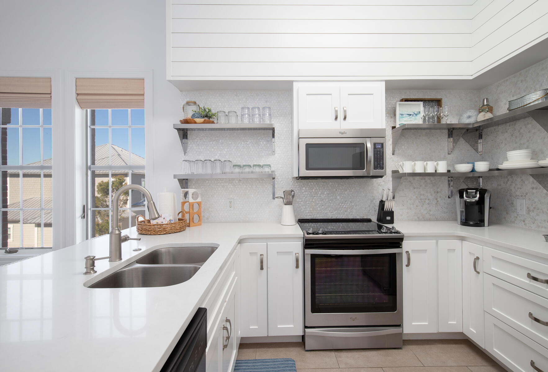 10343 East County Highway 30A, Unit 330 Inlet Beach, FL 32413 - Photo 11 of 30 a kitchen with stainless steel appliances granite countertop a sink and stove top oven