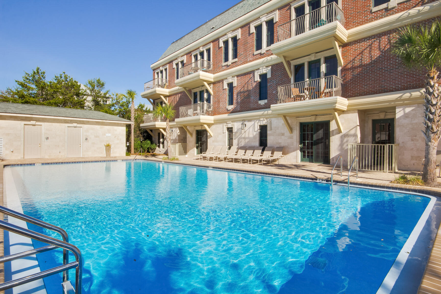 10343 East County Highway 30A, Unit 330 Inlet Beach, FL 32413 - Photo 23 of 30 a swimming pool with buildings in the background