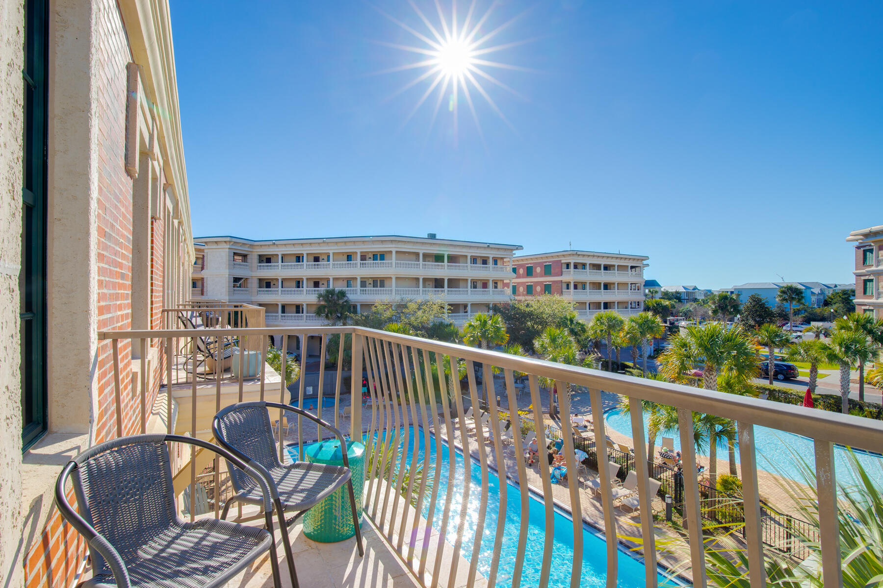 10343 East County Highway 30A, Unit 330 Inlet Beach, FL 32413 - Photo 3 of 30 a view of a balcony with wooden chairs