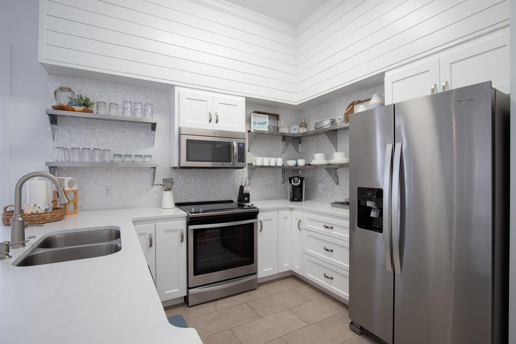10343 East County Highway 30A, Unit 330 Inlet Beach, FL 32413 - Photo 10 of 30 a kitchen with stainless steel appliances a refrigerator sink and stove