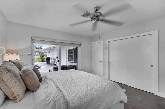 a bed room with a bed and a chandelier