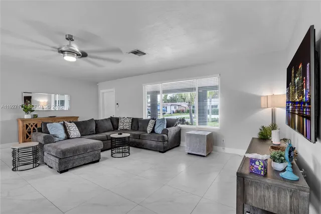 a living room with furniture and a window