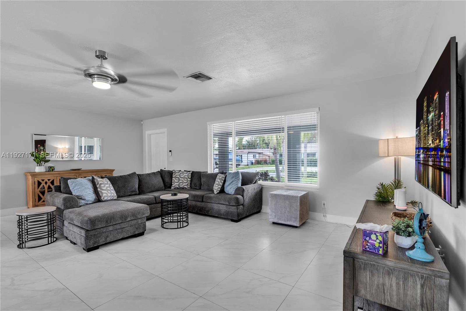 251 Southeast 8th Street Pompano Beach, FL 33060 - Photo 16 of 34 a living room with furniture and a window