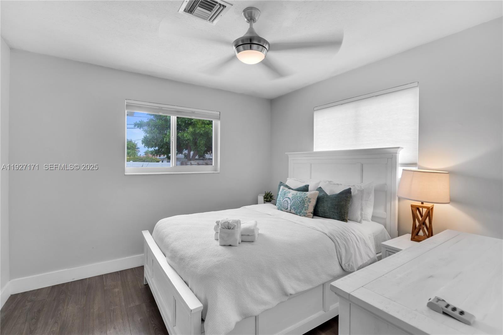 251 Southeast 8th Street Pompano Beach, FL 33060 - Photo 18 of 34 a bedroom with a bed and a window