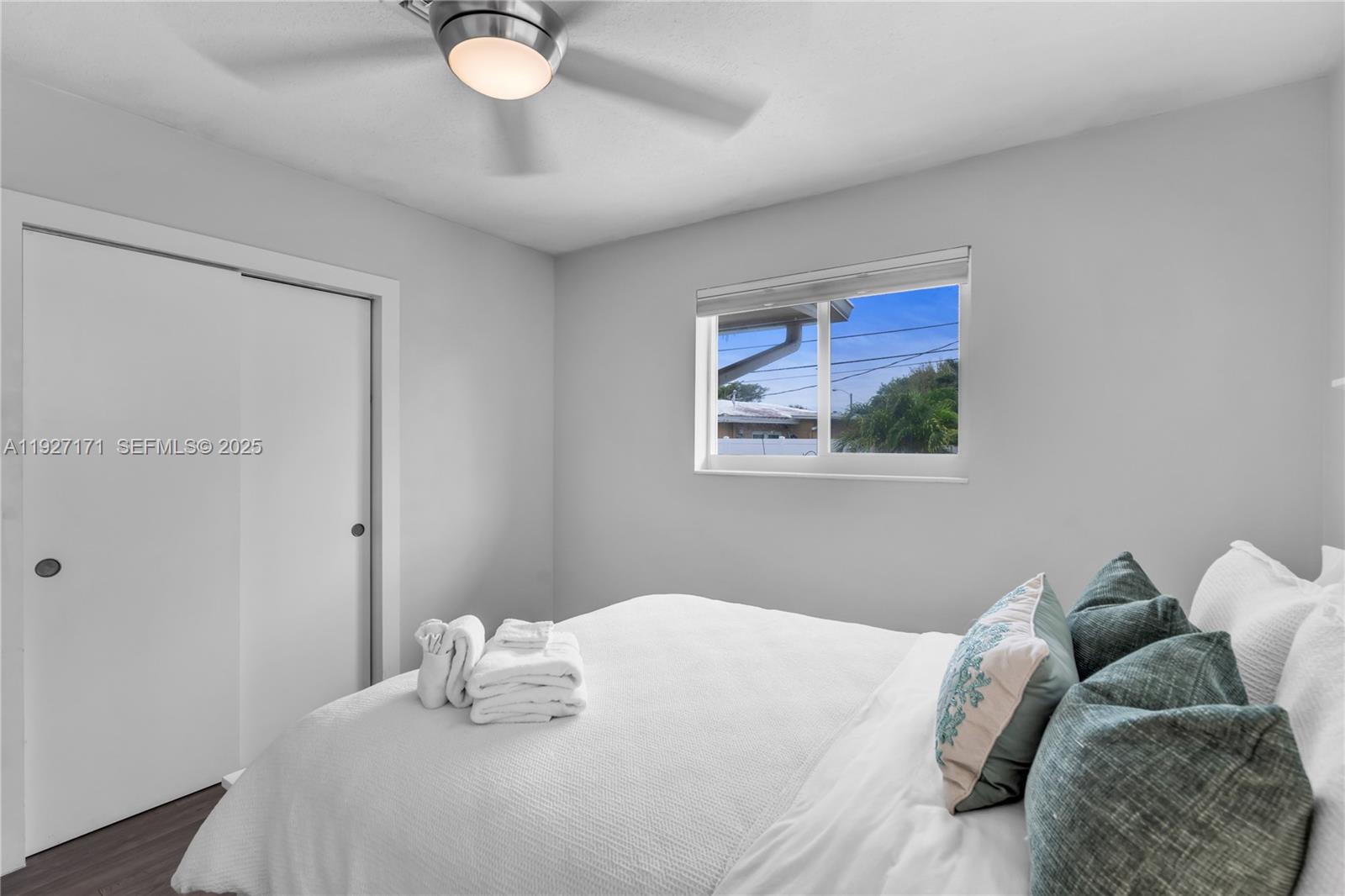 251 Southeast 8th Street Pompano Beach, FL 33060 - Photo 20 of 34 a bedroom with a bed and a painting on the wall