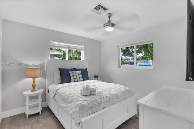 a bedroom with a bed and a table