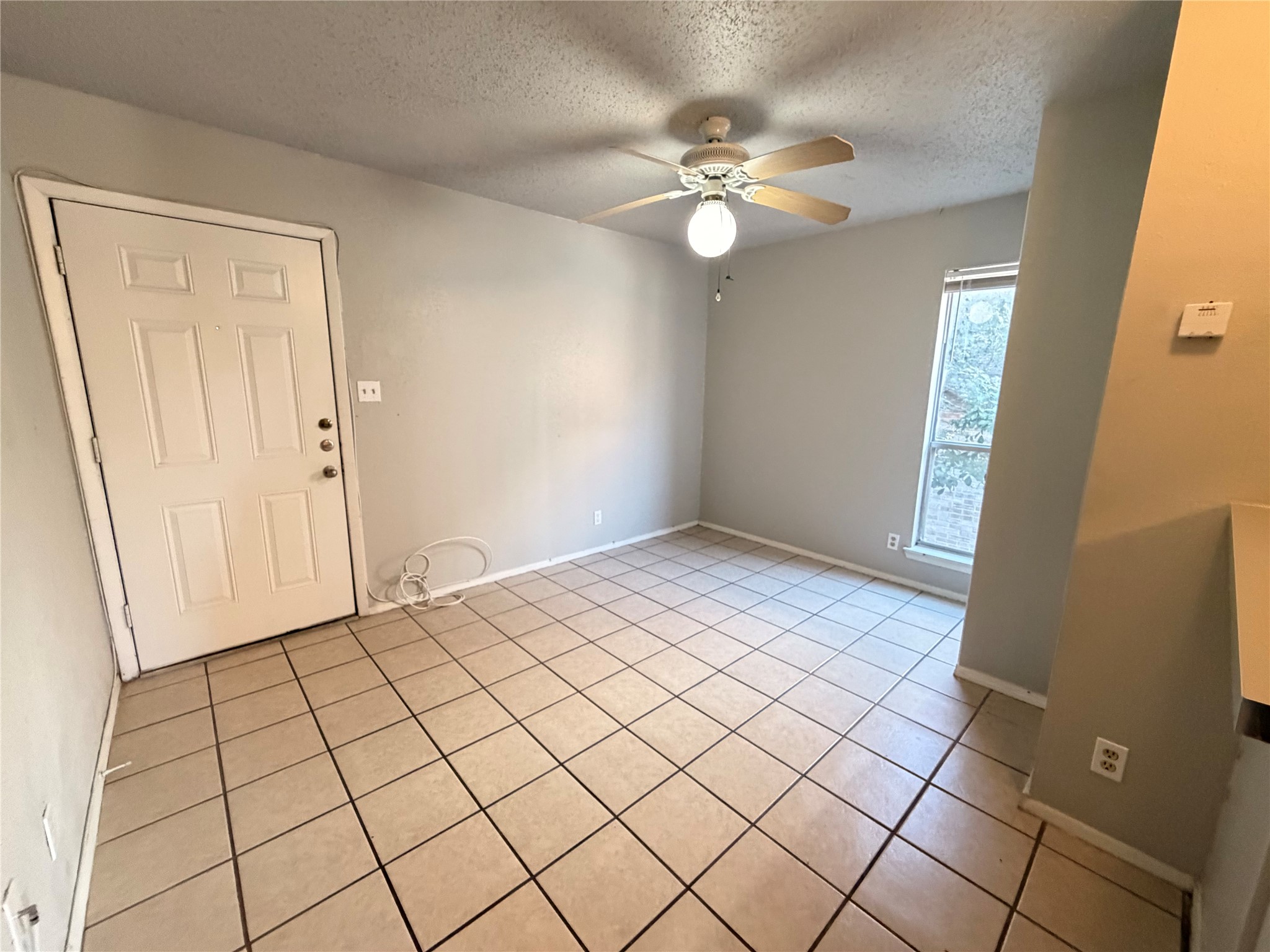 4303 Duval Street, Unit 204 Austin, TX 78751 - Photo 4 of 15 a view of an empty room and wooden floor