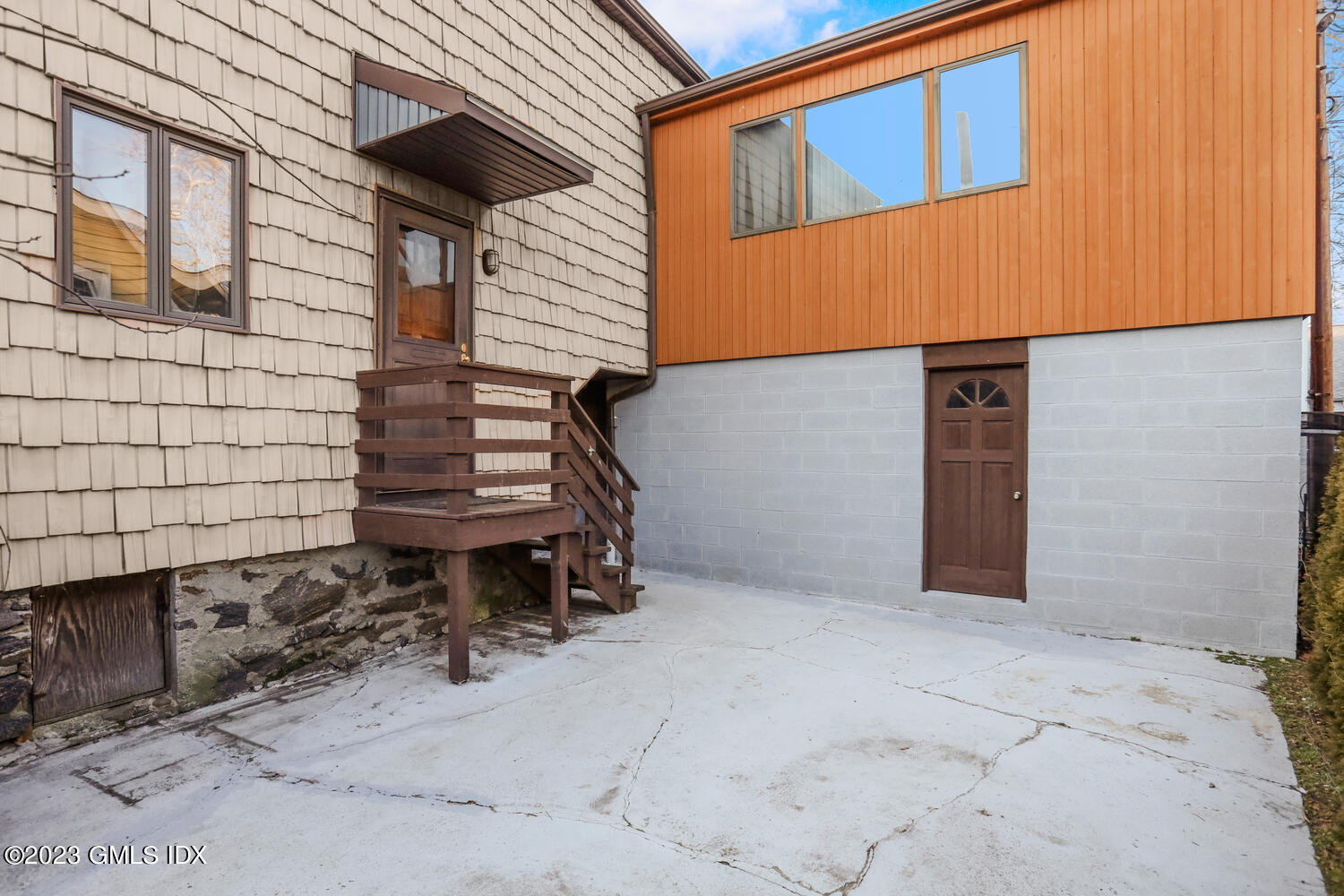 175 Davis Avenue Greenwich, CT 06830 - Photo 23 of 27 a view of a house with a small yard