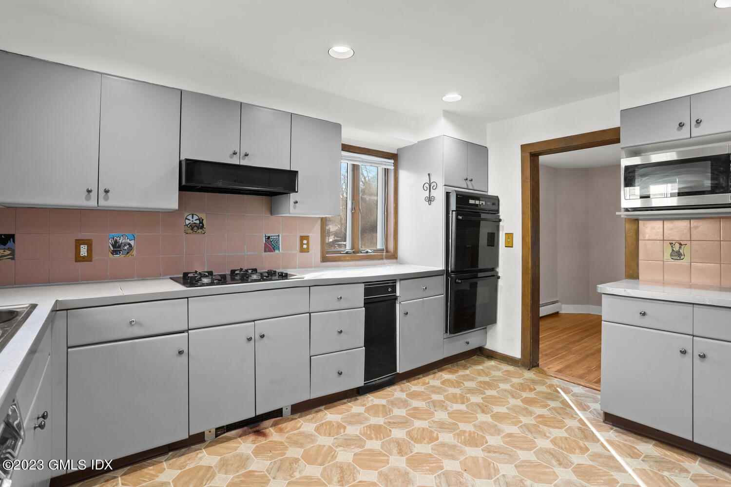 175 Davis Avenue Greenwich, CT 06830 - Photo 7 of 27 a kitchen with stainless steel appliances granite countertop a sink and cabinets