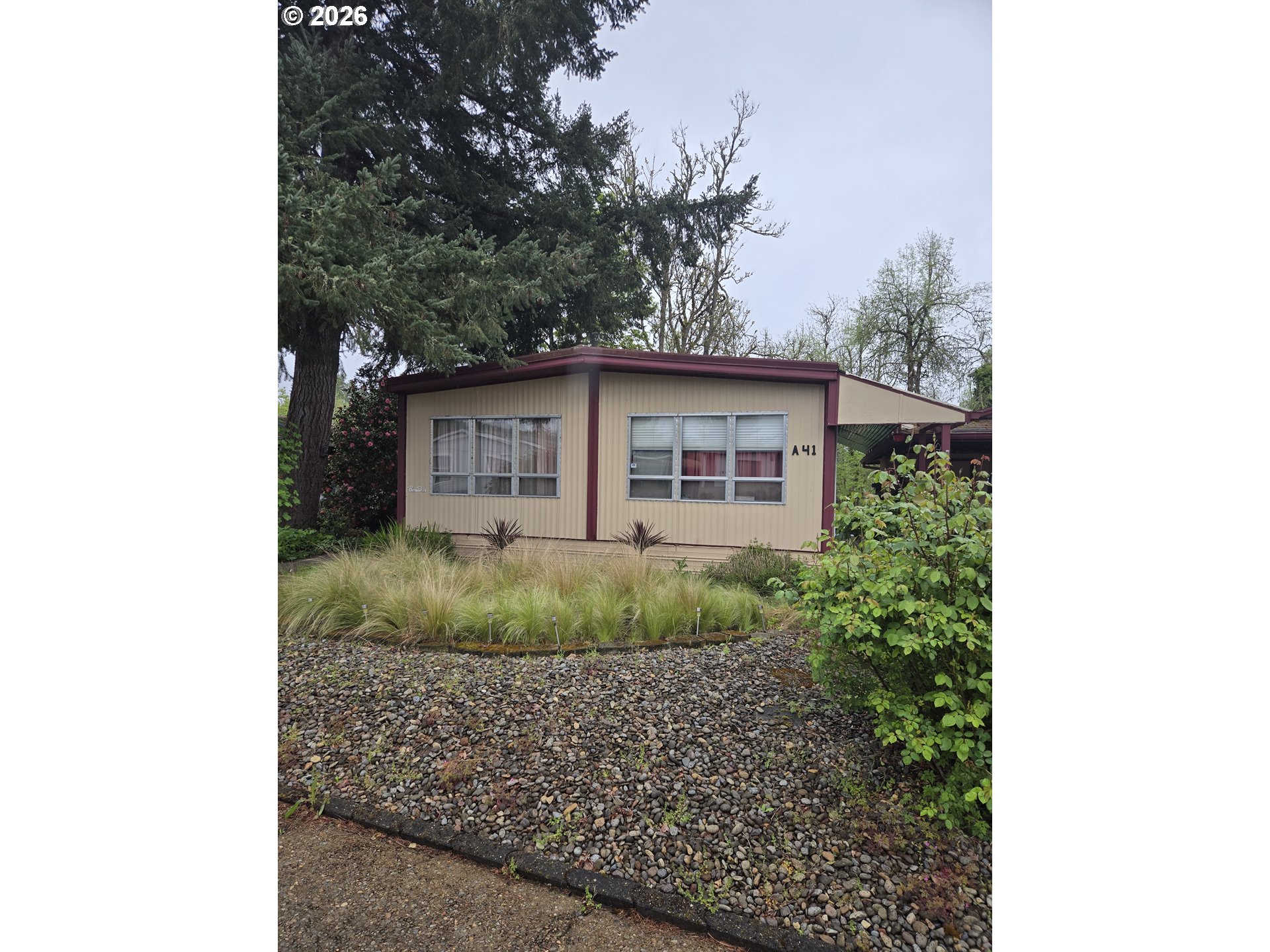 77500 South 6th Street Cottage Grove, OR 97424 - Photo 1 of 16 a view of a house with a yard plants and large tree